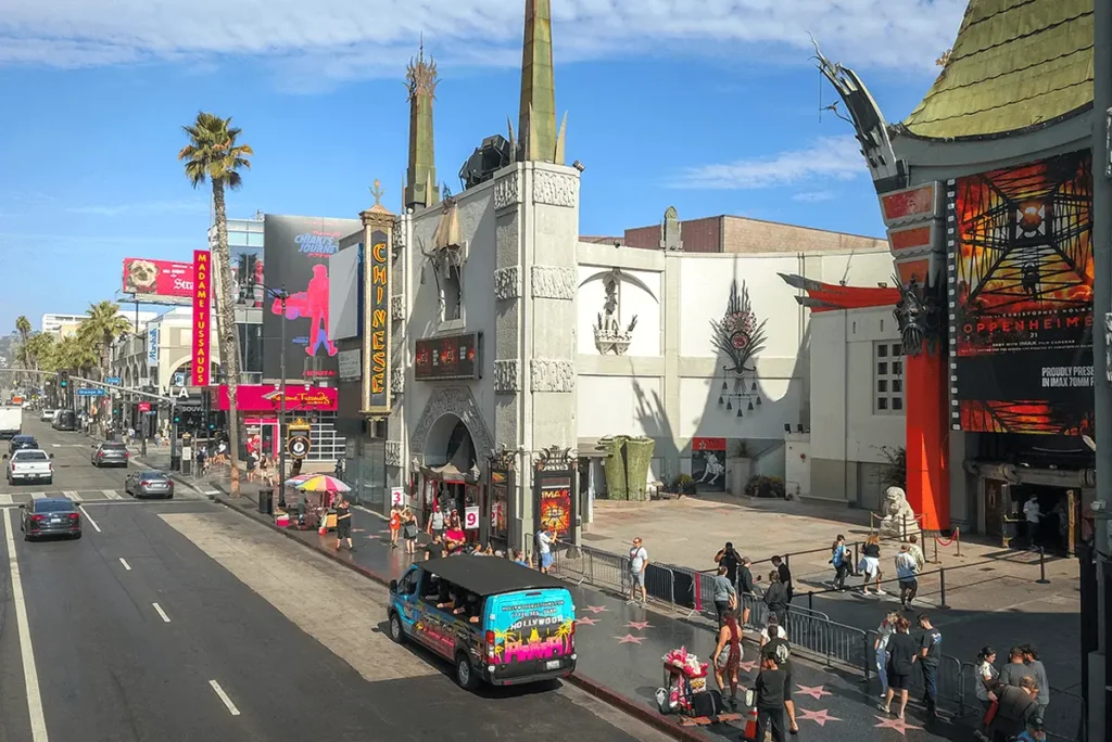 Hollywood tour buses parked in front of the TCL Chinese Theatre on Hollywood Boulevard.