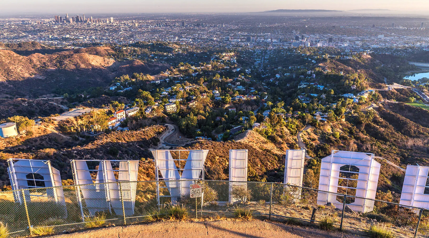 View from behind the Hollywood Sign overlooking Los Angeles at sunset