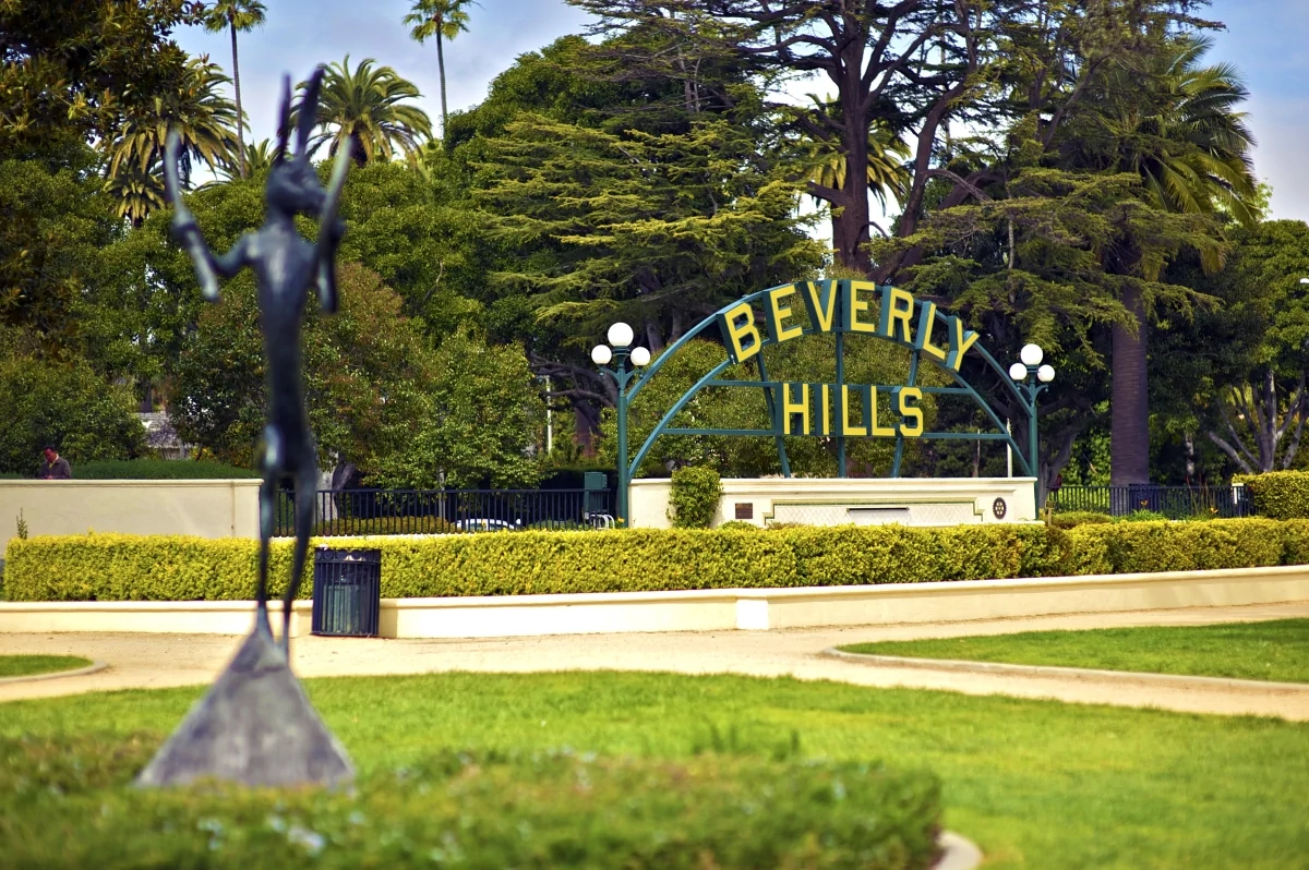 Beverly Hills entrance sign with palm trees Los Angeles