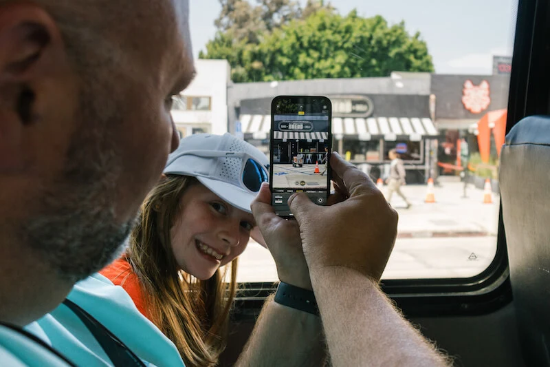 Family taking a photo during Hollywood Bus Tour