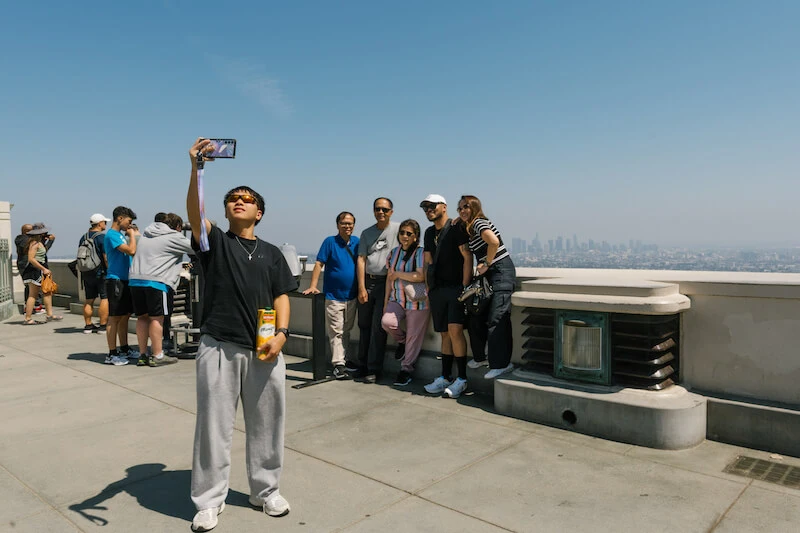 Family taking a photo together at Griffith observatory