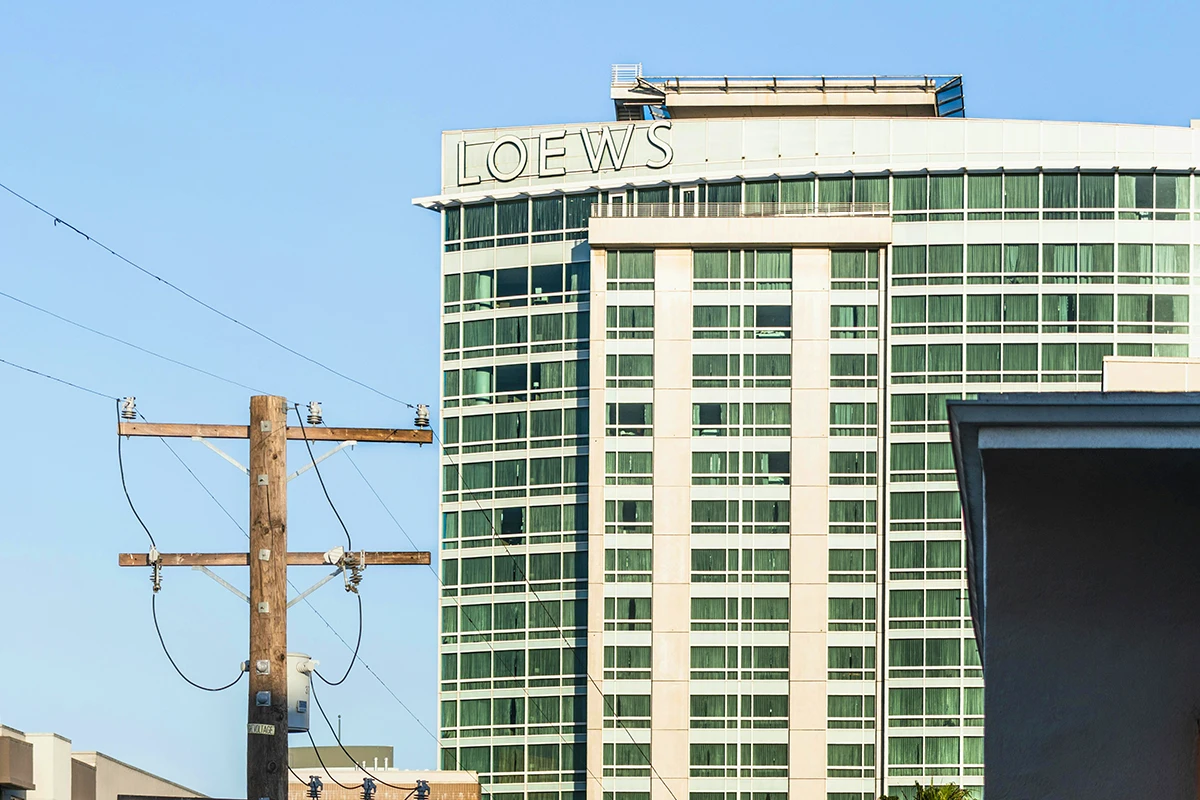 Loews Hotel downtown Los Angeles high-rise building with green windows and power lines, iconic stop on Hollywood sightseeing bus tours