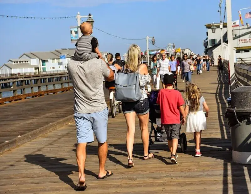 Family walking on pier