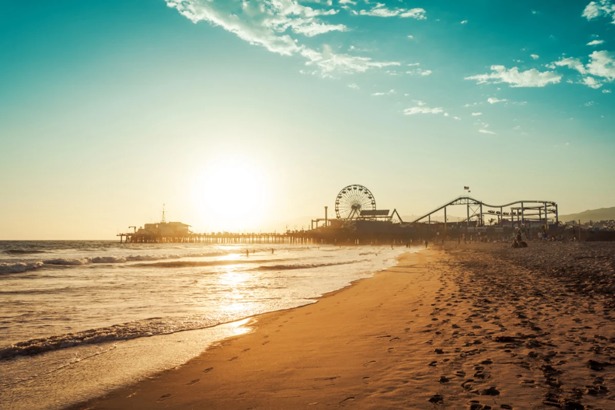 Santa Monica Pier sunset with Ferris wheel and beach creating coastal scene