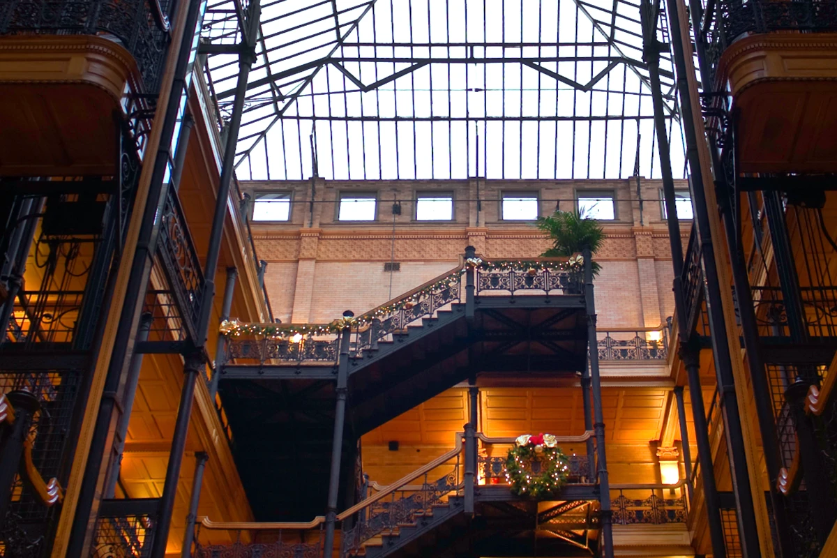 Historic indoor shopping arcade with ornate ironwork and balconies
