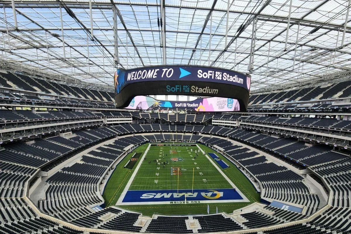 Interior view of SoFi Stadium in Los Angeles showing the football field and seating bowl before an NFL game