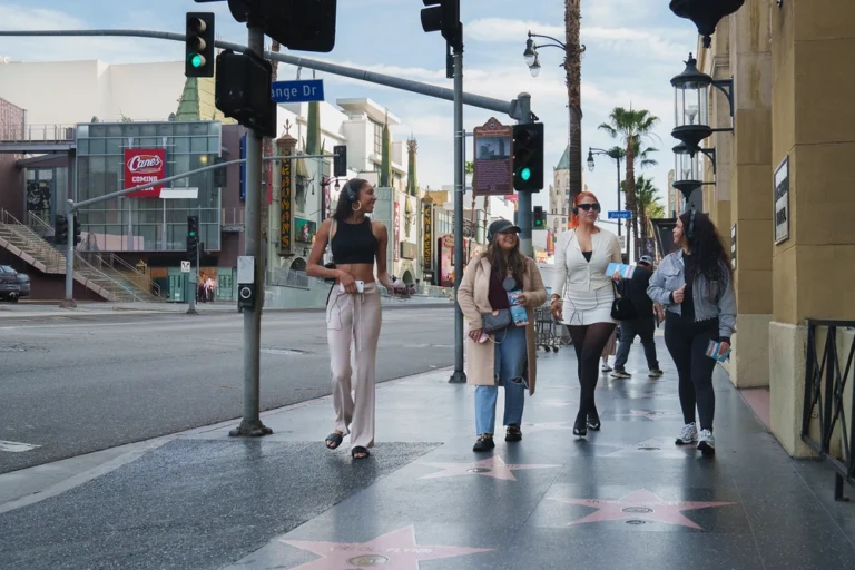 Private Hollywood tour guests walking along Hollywood Boulevard