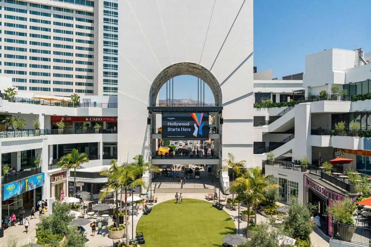 Ovation Hollywood outdoor shopping center courtyard with digital screen and retail stores in Hollywood Los Angeles