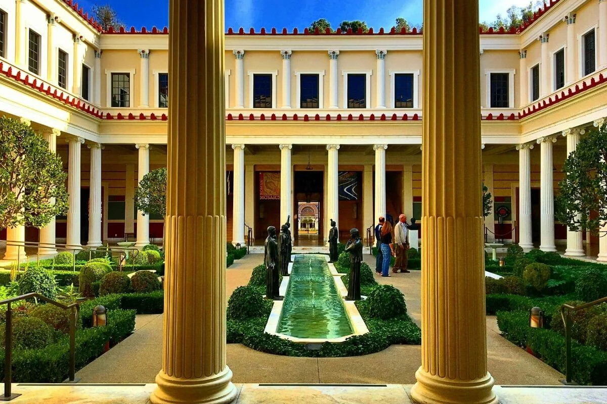 Getty Villa peristyle garden with columns, fountain, and statues