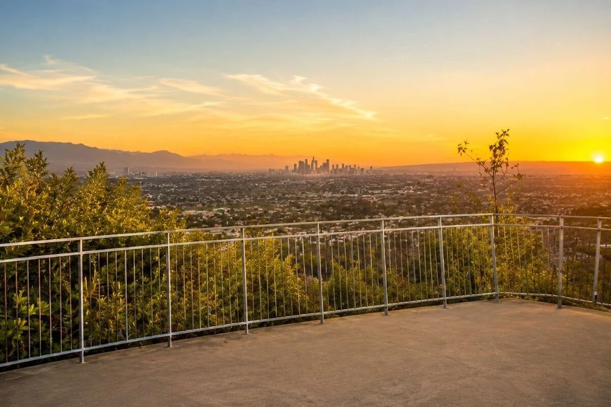 Overlook deck with view of downtown LA skyline at sunset