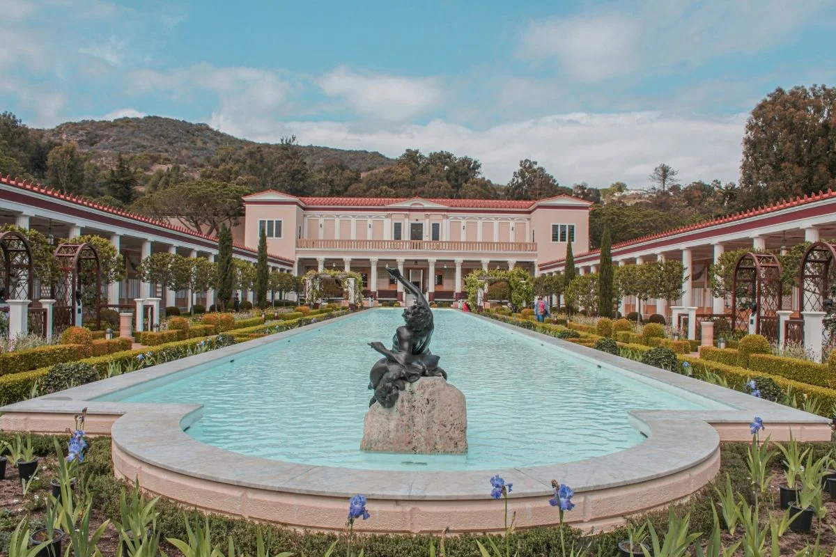 Bronze fountain sculpture in the center of the Getty Villa's classical Roman-style garden courtyard