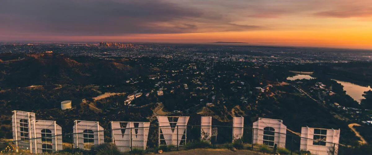 Hollywood sign overlooking LA skyline at sunset