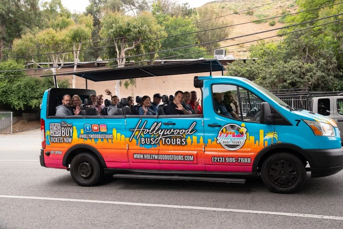 Open air Hollywood Bus Tours van with passengers near West Hollywood