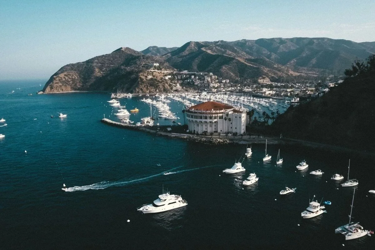 Aerial view of Avalon Harbor with boats and the Catalina Casino building on Catalina Island